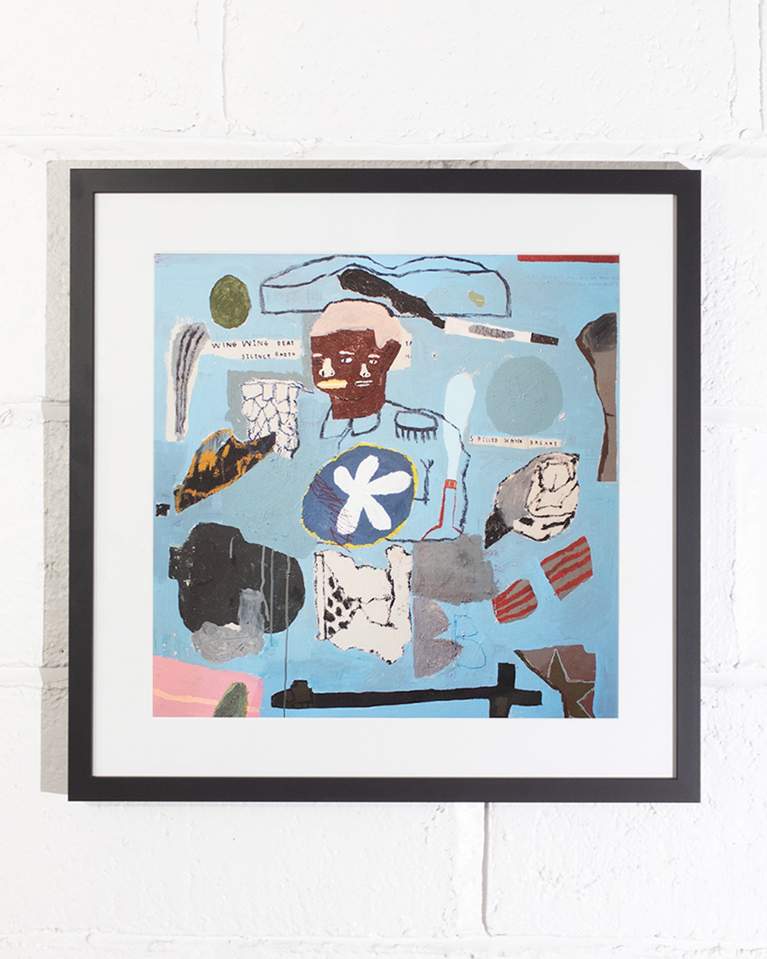Framed artwork with abstract design on a white wall